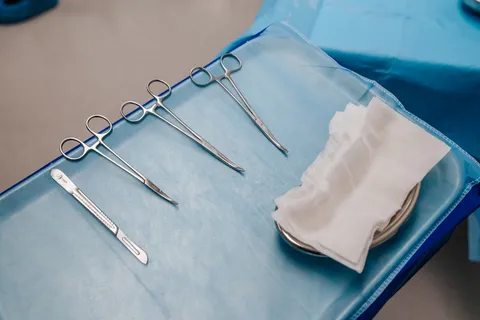 Sterile podiatry instruments laid out on a sterile drape, ready for a home visit appointment
